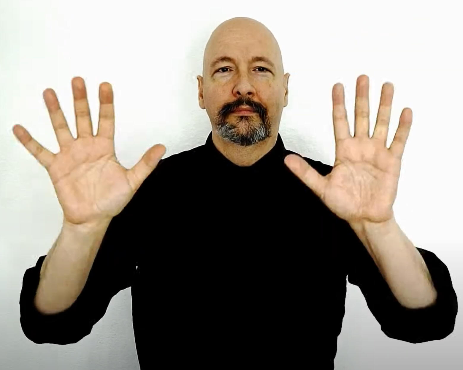 Man signing "weather" in American Sign Language